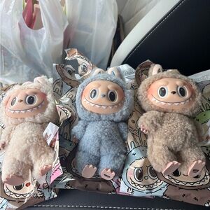 Adorable Plush Monster Trio - Cream, Blue, and Brown